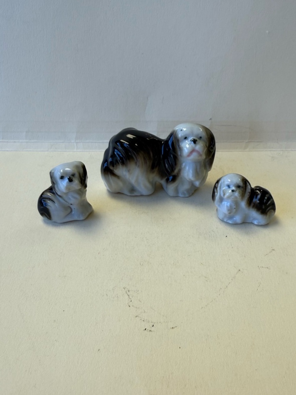 Set of Vintage Ceramic Pekingese Mother Dog And 2 Puppy Figurines.